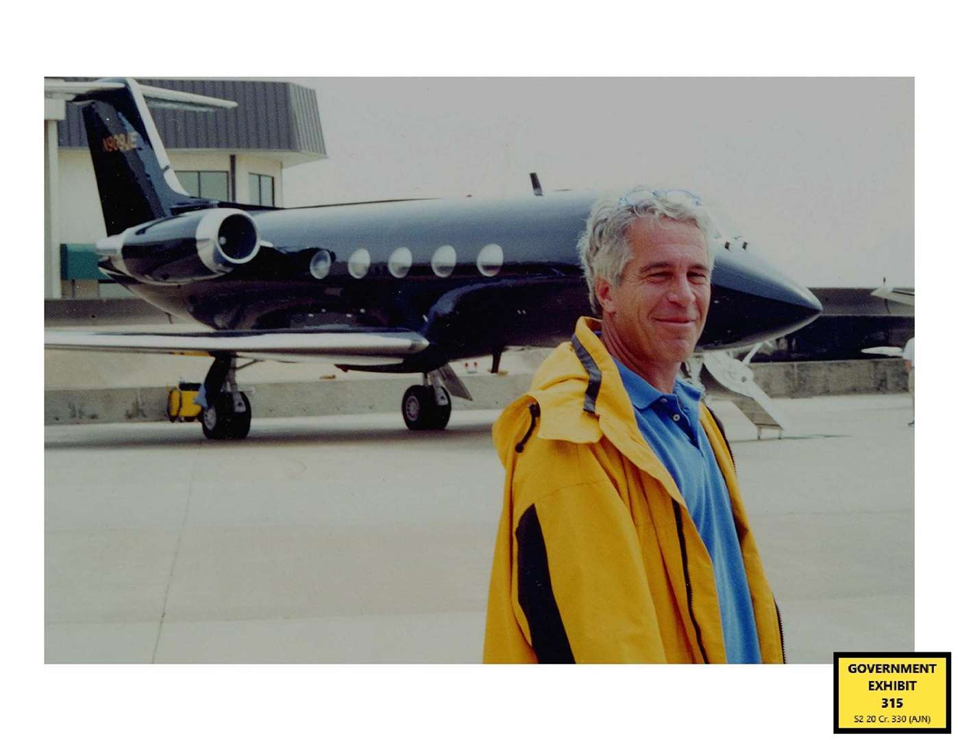 Jeffrey Epstein standing in front of a private plane (US Department of Justice)