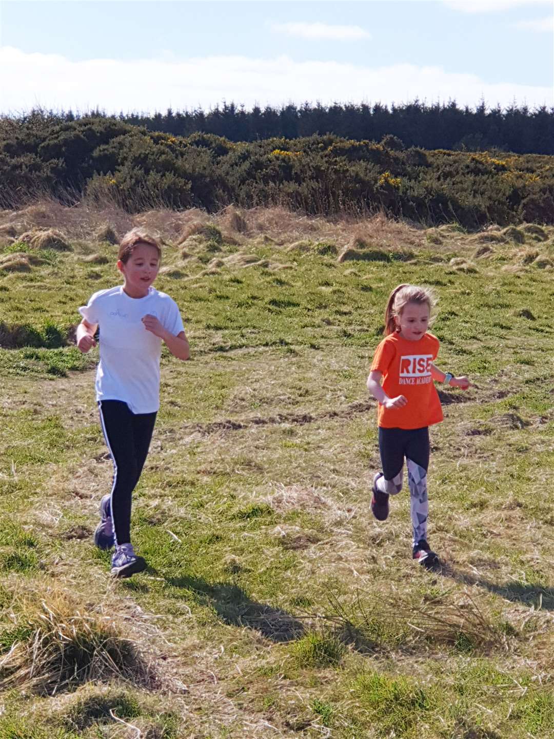 Beth (in white) and Elsa Stockan on their 3k run as part of the North Highland Harriers' virtual challenge.