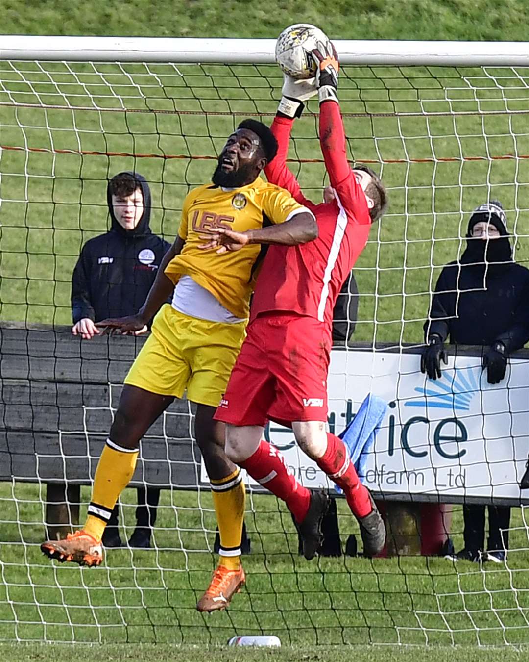 James More gathers the ball under pressure from Fort William's Yves Zama. Picture: Mel Roger