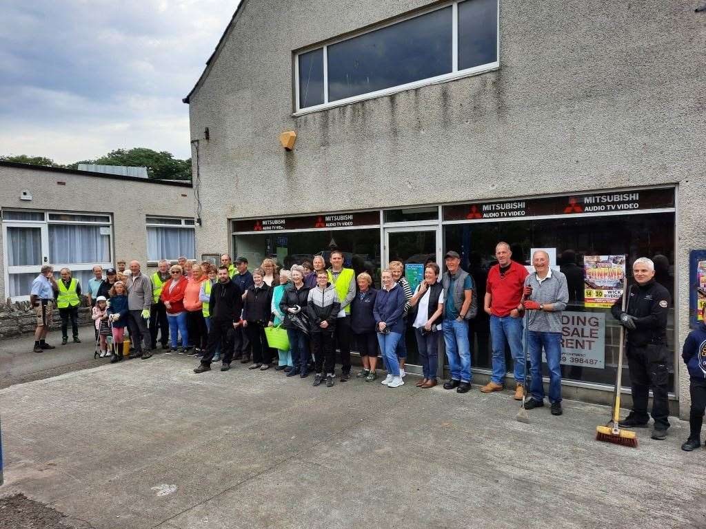 Wick community councillor Allan Bruce (centre, in high-vis jacket) and other volunteers at the summer spruce-up event in July 2022.