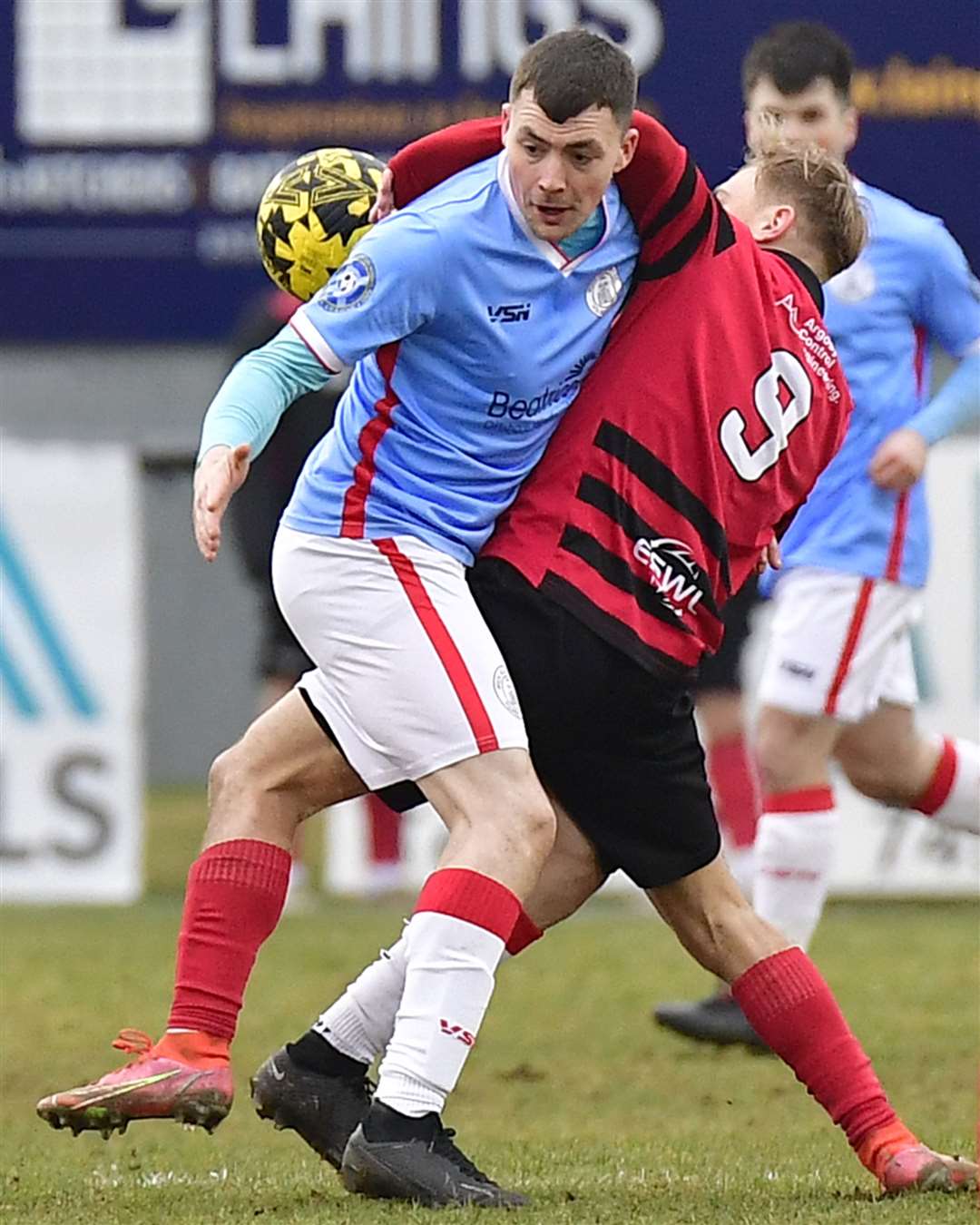 Wick Academy's Ryan Campbell tangles with Nathan Meres of Inverurie Locos. Picture: Mel Roger