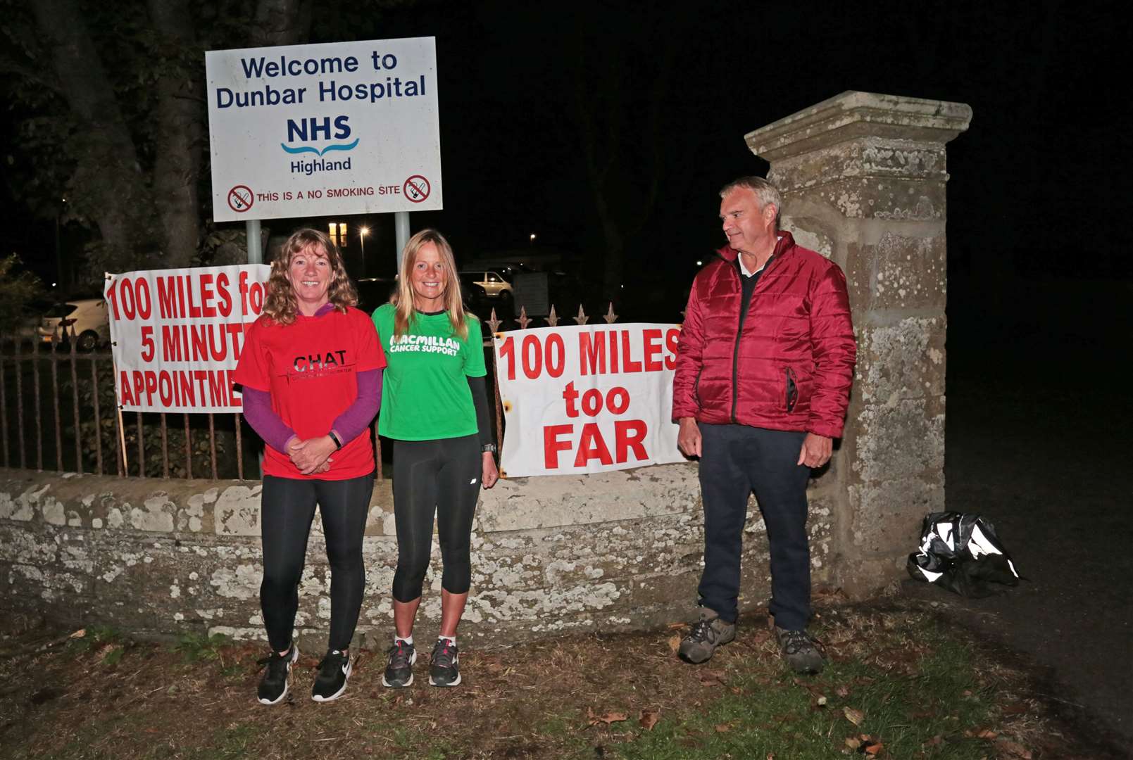 Lorna Stanger (centre) about to set off from Thurso's Dunbar Hospital at midnight on Tuesday. Her twin sister Trish Cowie ran with her to the outskirts of Thurso. She was waved off by CHAT vice-chairman Ron Gunn. Picture: Robert MacDonald / Northern Studios