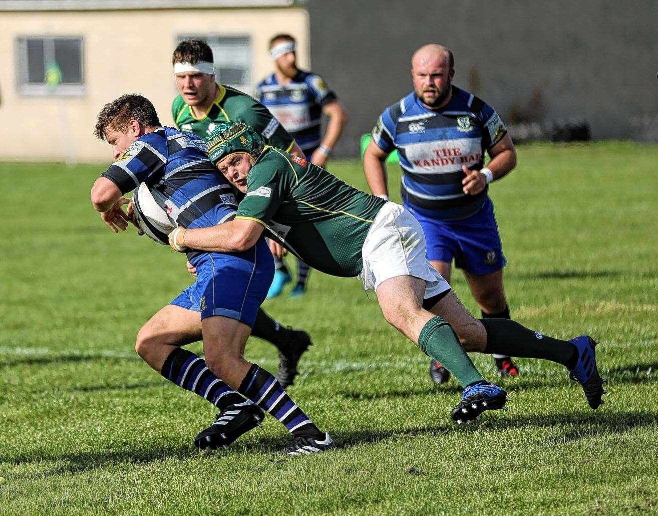 Hamish Coghill makes a tackle for the Greens in a defeat to Ardrossan last season. Picture: James Gunn
