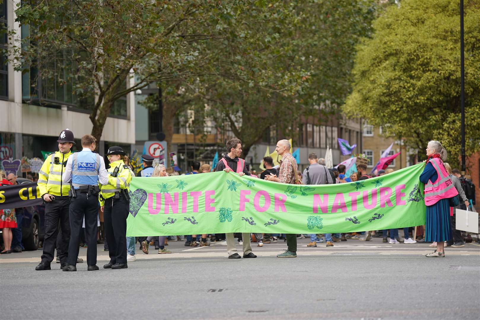 Campaigners blocked the road outside the Defra offices as they demanded more action on nature protection (Yui Mok/PA)