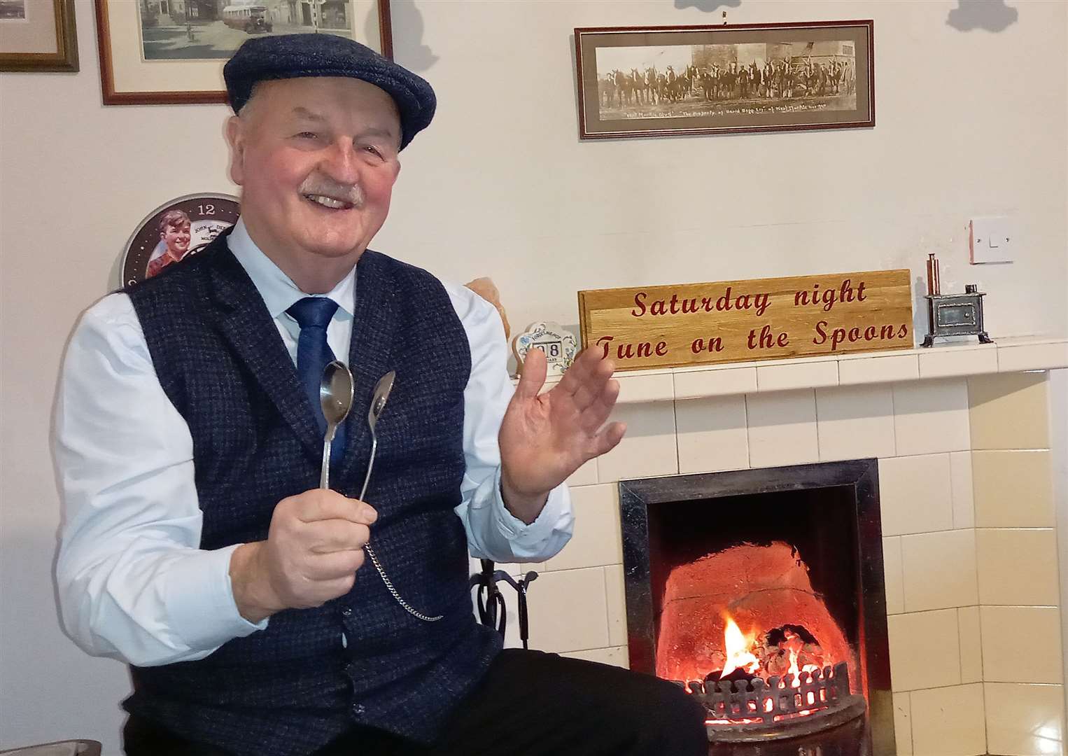 Willie Mackay on his regular Saturday night Tunes on the Spoons by the fireside in his cottage at Oldhall, Watten.