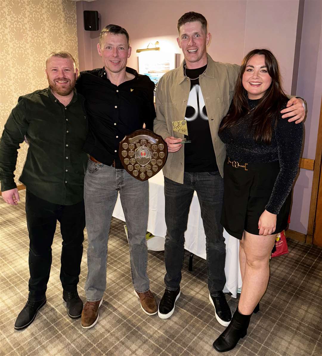 Men’s doubles winners Mark Mackay and Martyn Cook with Mark Mackay (Dounreay Communities Fund) and Kate Mackay (Caithness Badminton Association).