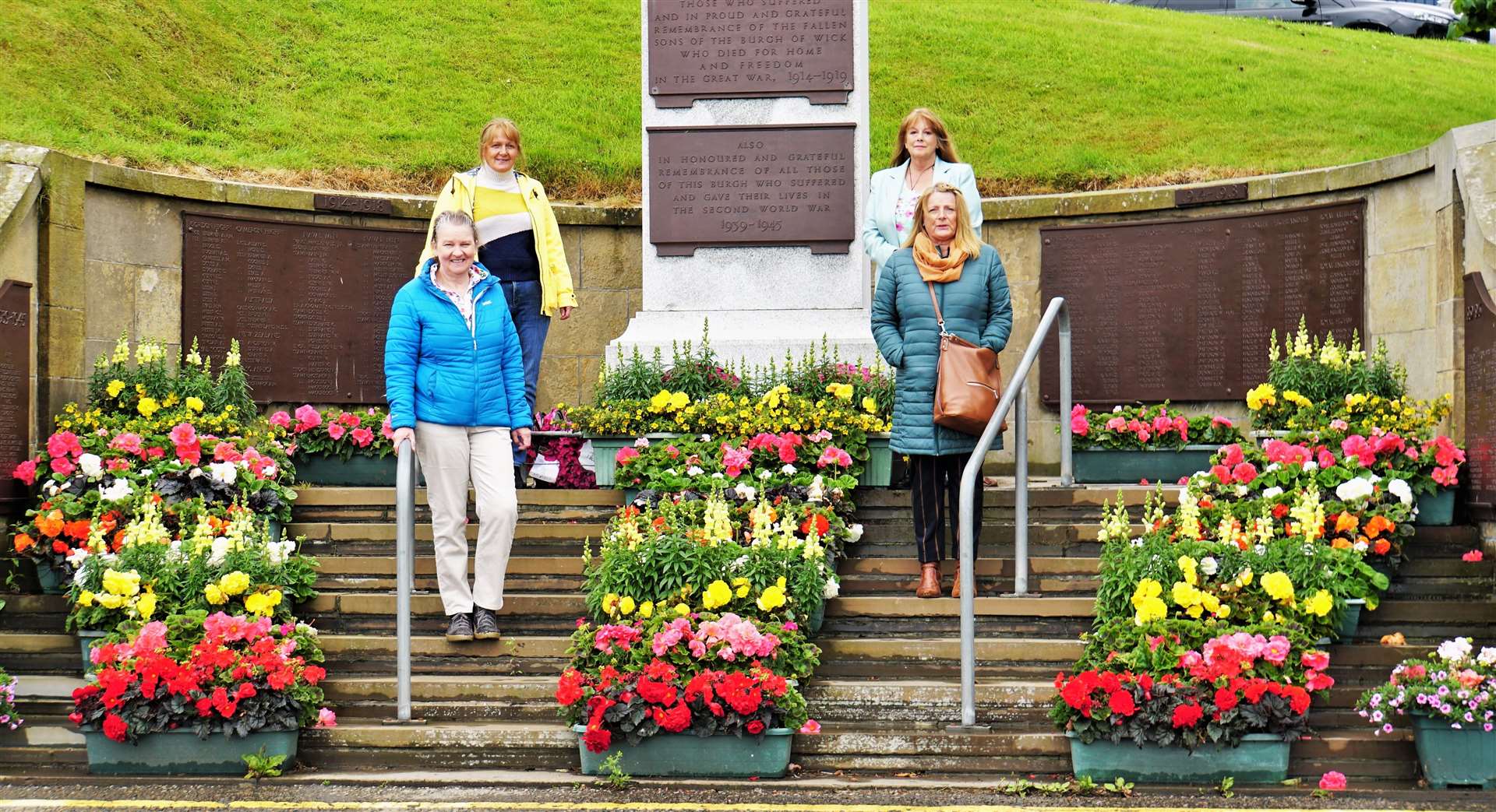 Some of the volunteers from Wick Flower and Hanging Baskets Committee beside a fine display they put together at the town's war memorial. Front from left, Anne Duffy and Joanna Coghill. Rear from left, Julie Wilson and Eswyl Fell. Picture: DGS