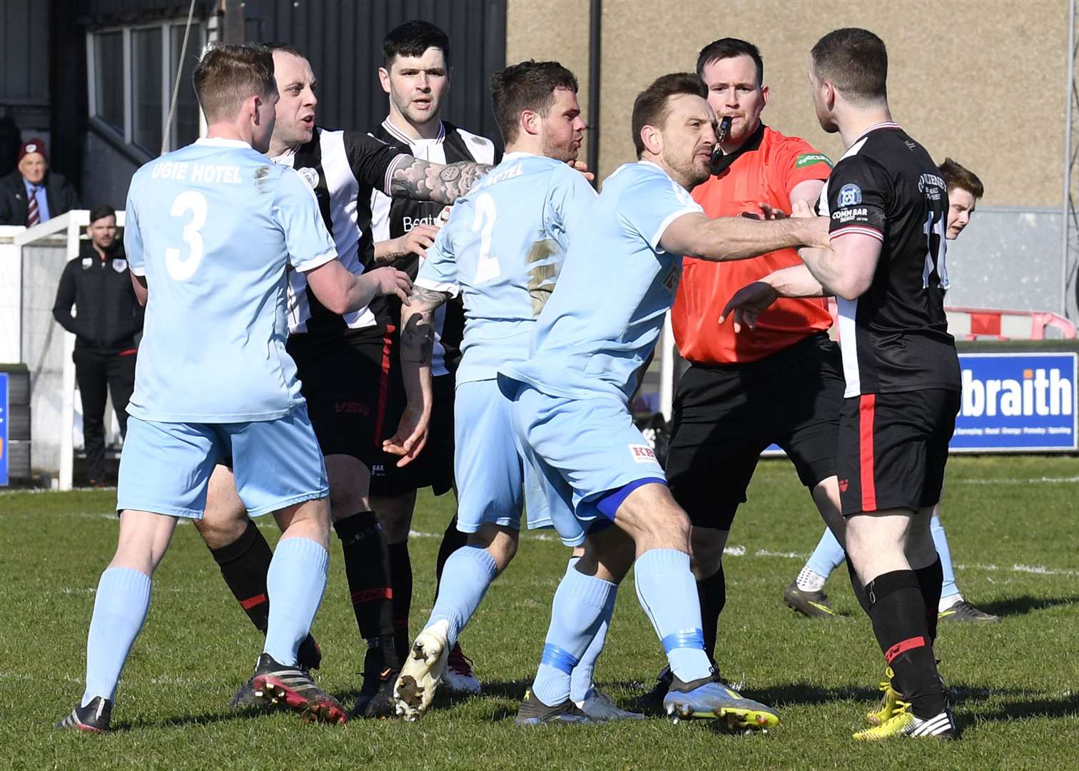 Referee Darren Munro steps in as Keith's Jamie McAllister lays hands on Wick's Davie Allan during Saturday's 2-2 draw. Picture: Mel Roger