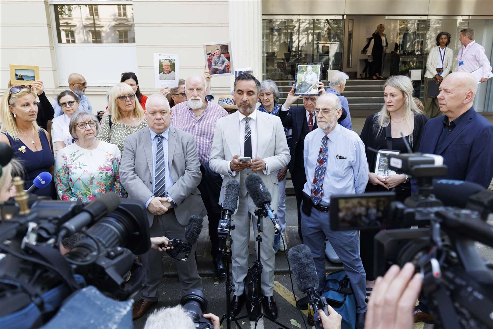 Aamer Anwar (centre), lead solicitor for the Scottish Covid Bereaved group, urged witnesses to speak with ‘absolute candour’ (Belinda Jiao/PA)