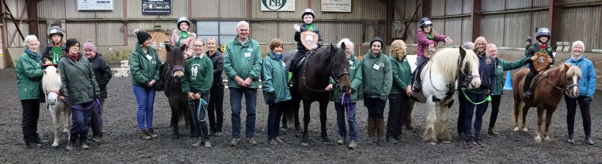 Ride two children with Frank Stephen, who handed over the trophies and rosettes, and RDA volunteers. Picture: Neil Buchan