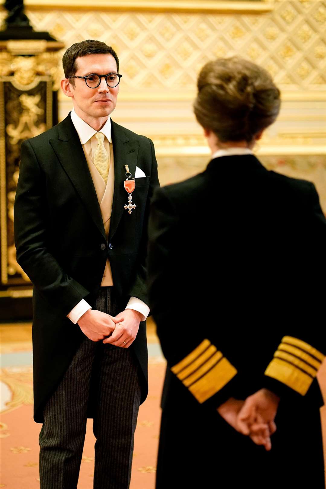 Erdem Moralioglu receives his honour from the Princess Royal (Aaron Chown/PA)