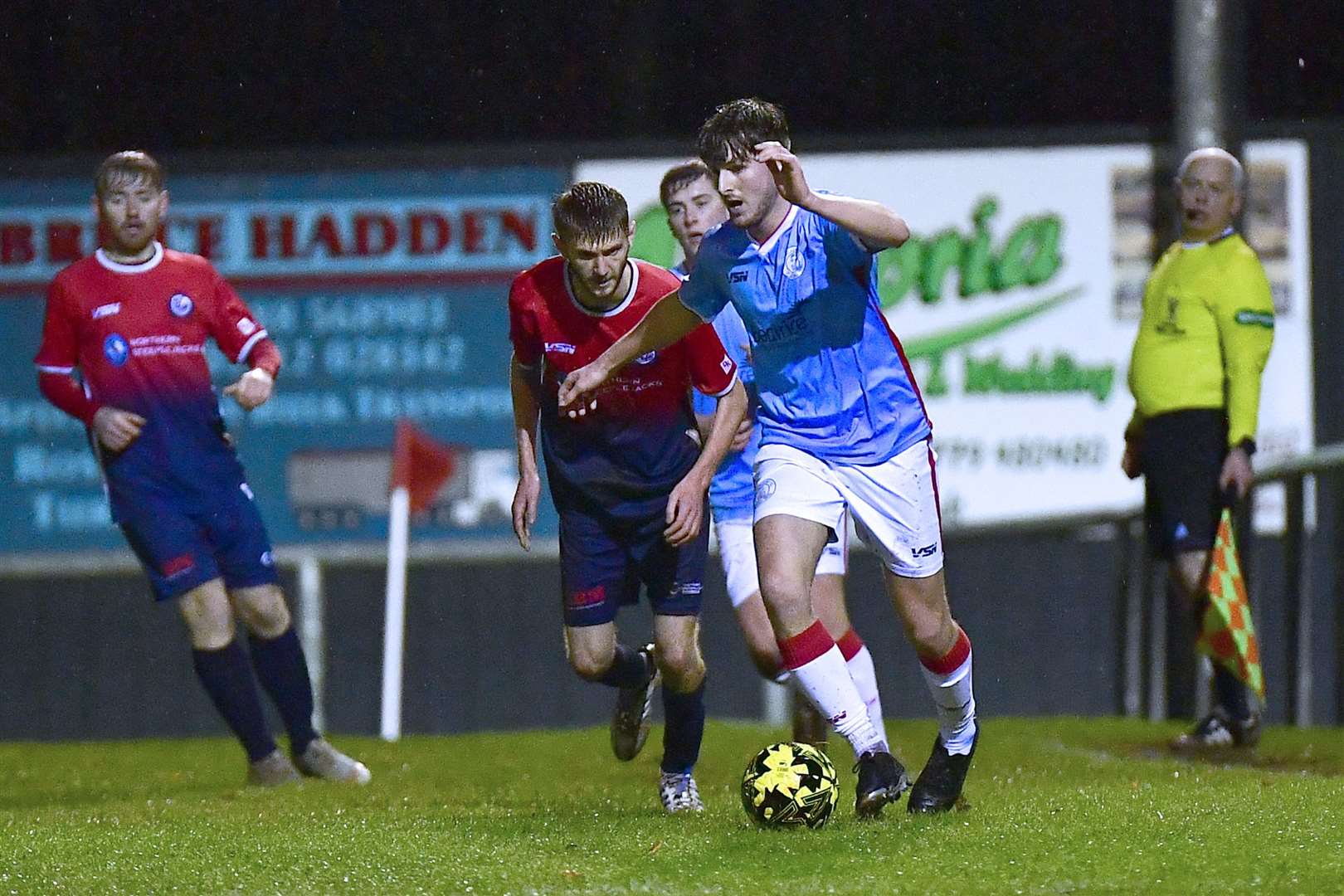 Wick Academy's Brandon Sinclair is pursued by Turriff United's Ewan Clark. Picture: Mel Roger