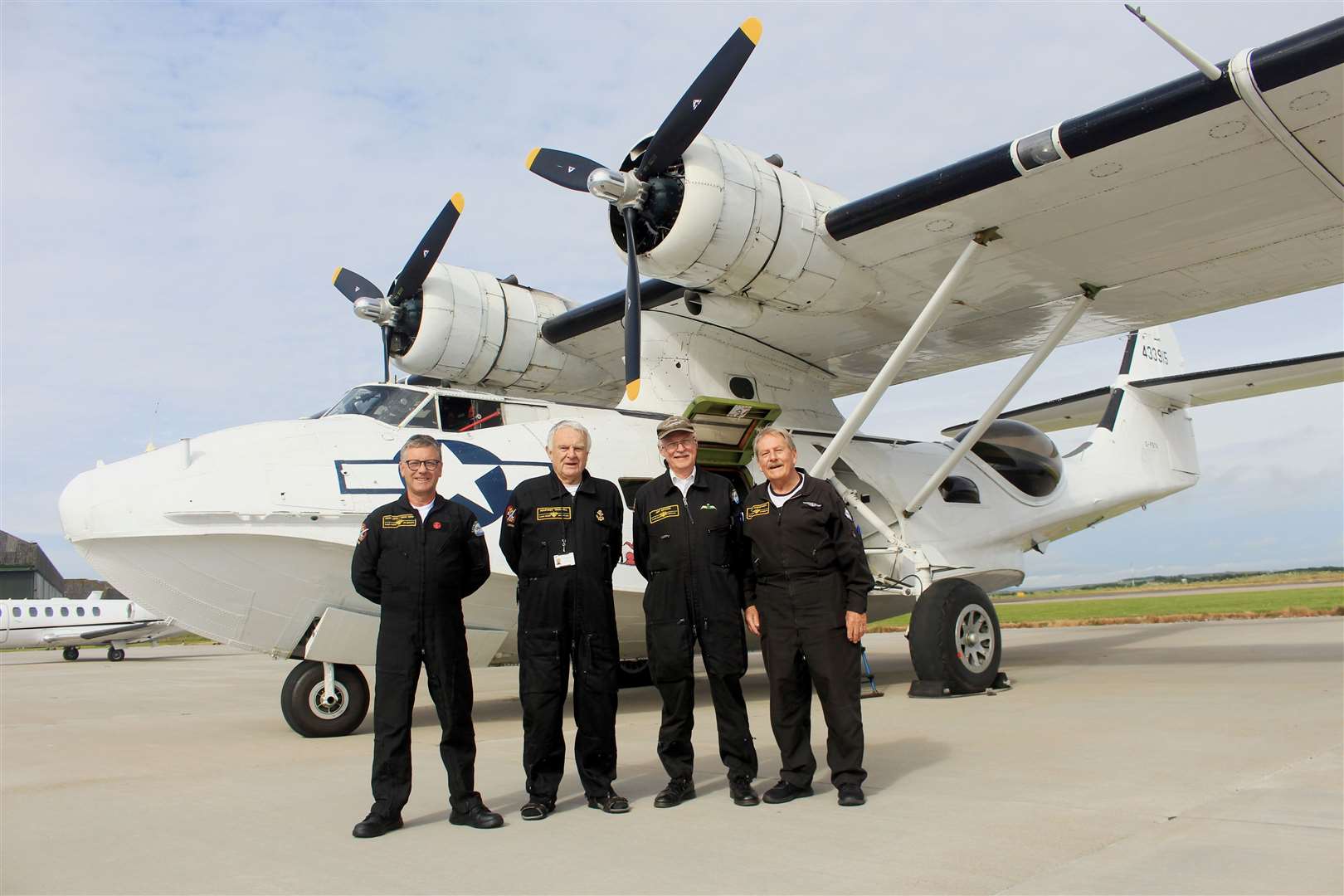 Crew members (from left) David Legg, Humphrey Truswell, Jeff Boyling and John Harmsworth beside the Catalina at Wick on Friday. Picture: Alan Hendry