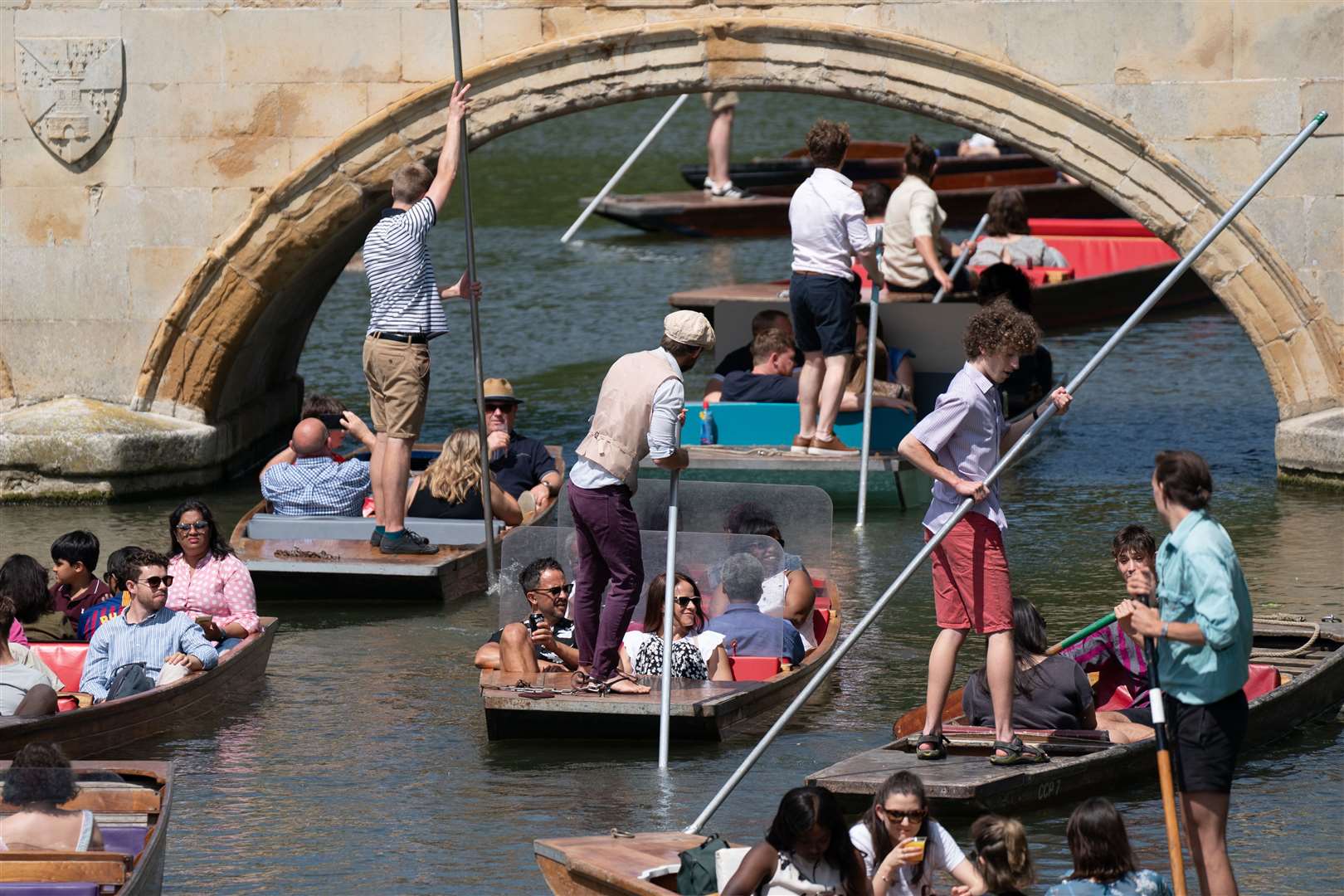 People enjoy punt tours along the River Cam in Cambridge (Joe Giddens/PA Images)