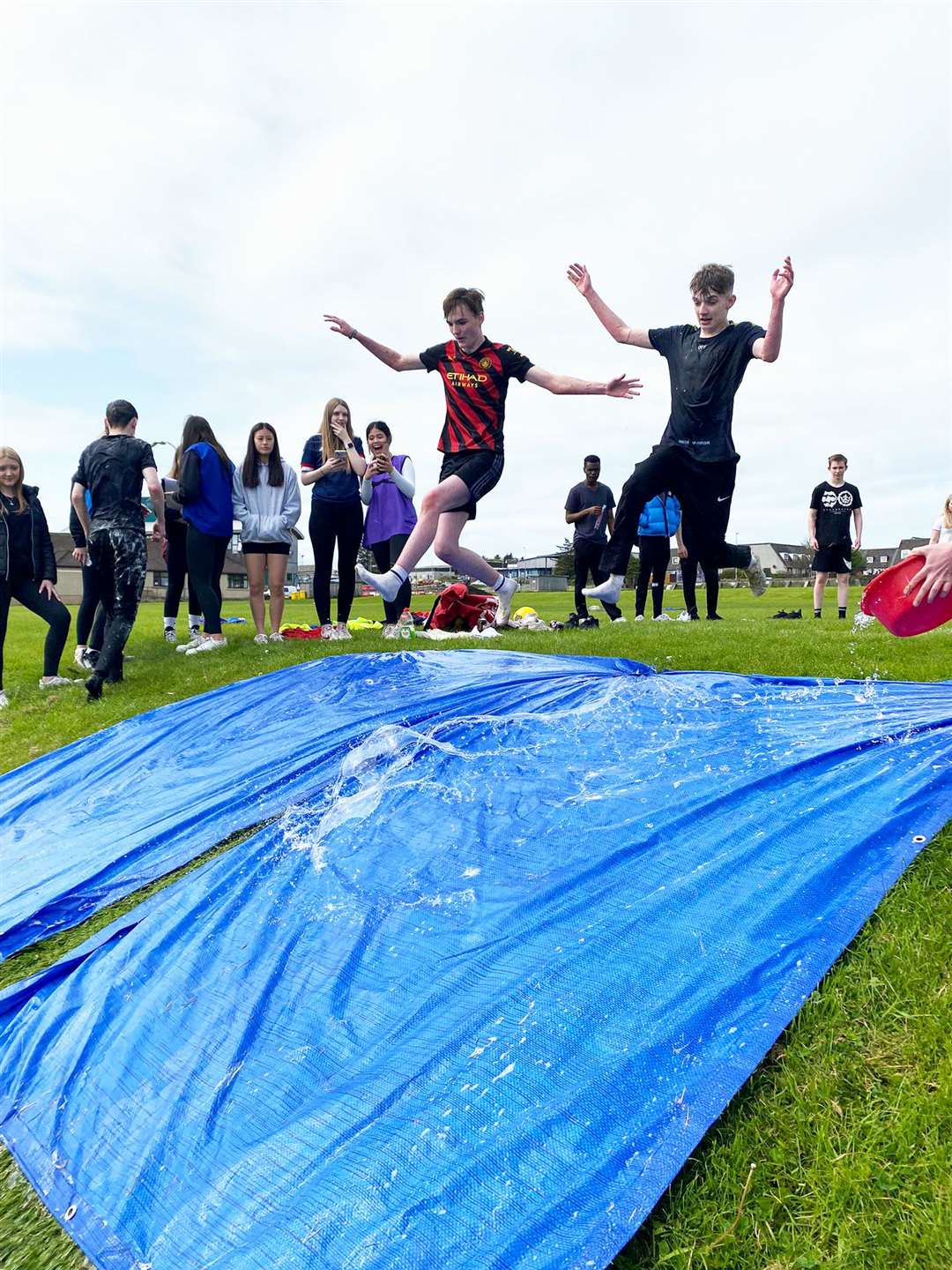 Senior pupils slipping and sliding during their fun day.