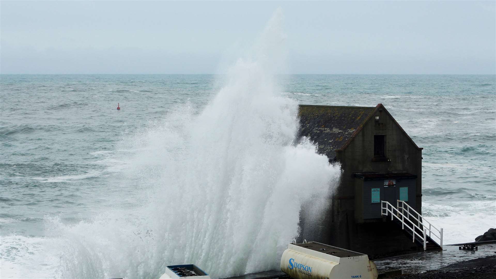 A powerful wave at the former lifeboat station on the south side of Wick Bay on Sunday. Picture: Alan Hendry