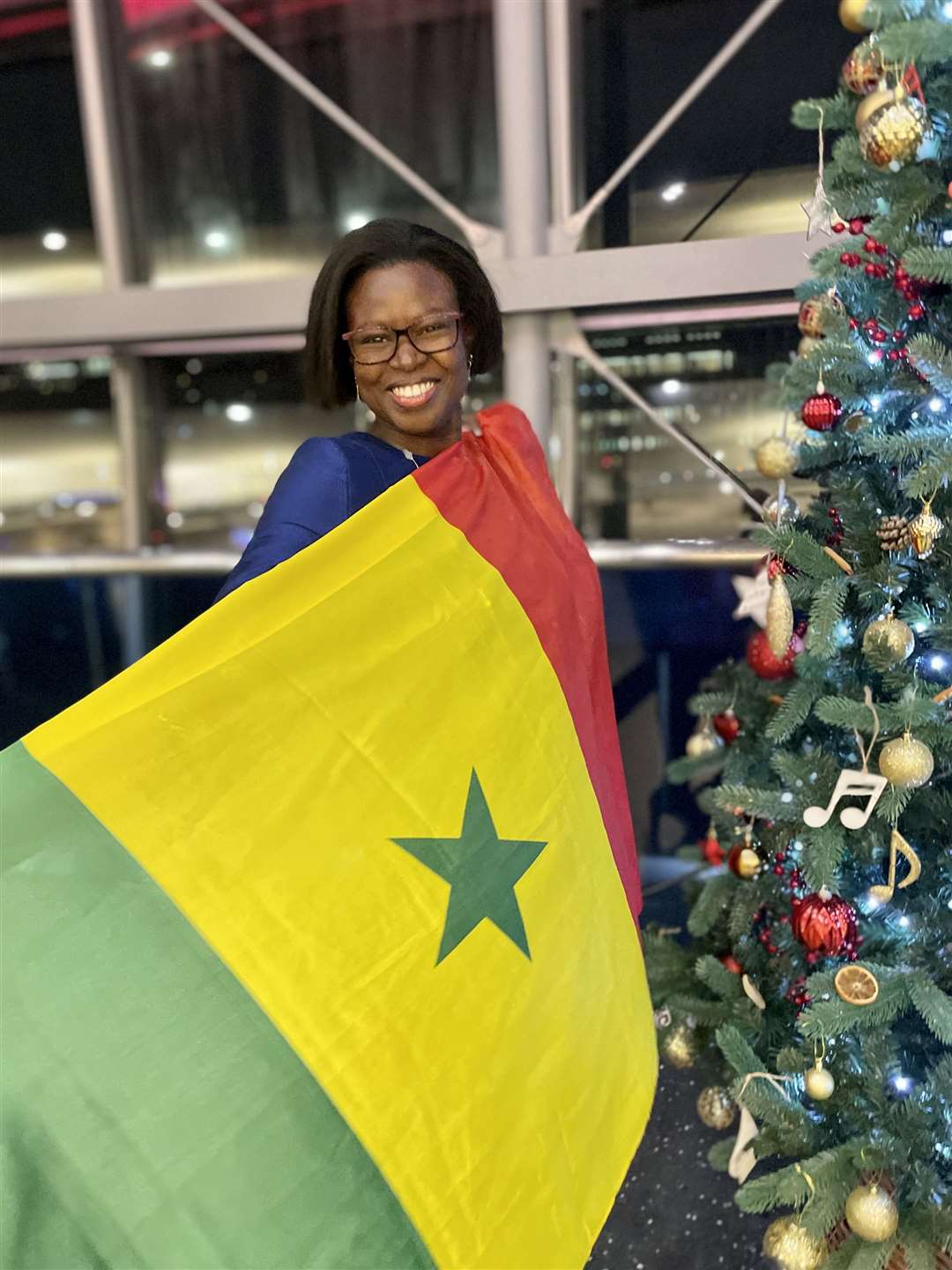 Faty Kane holding the flag of Senegal (Faty Kane)