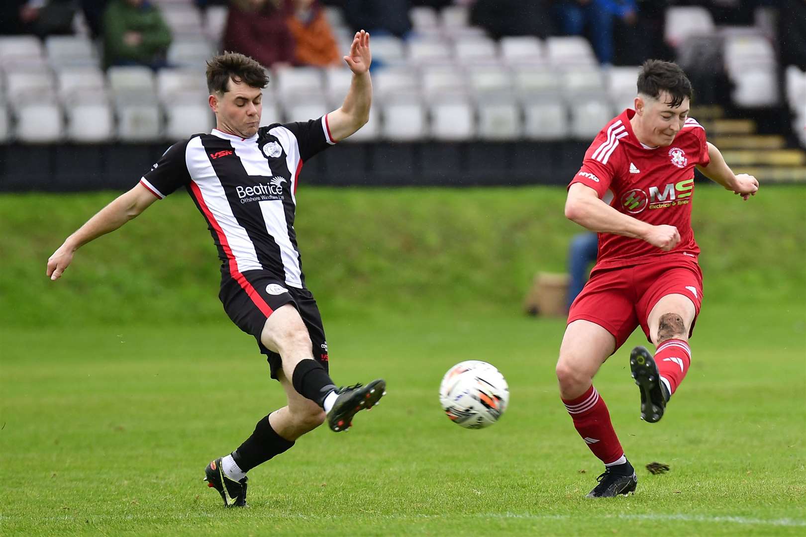 Marc Coghill attempts to block a shot from Lossiemouth's Henry Jordan. Picture: Mel Roger