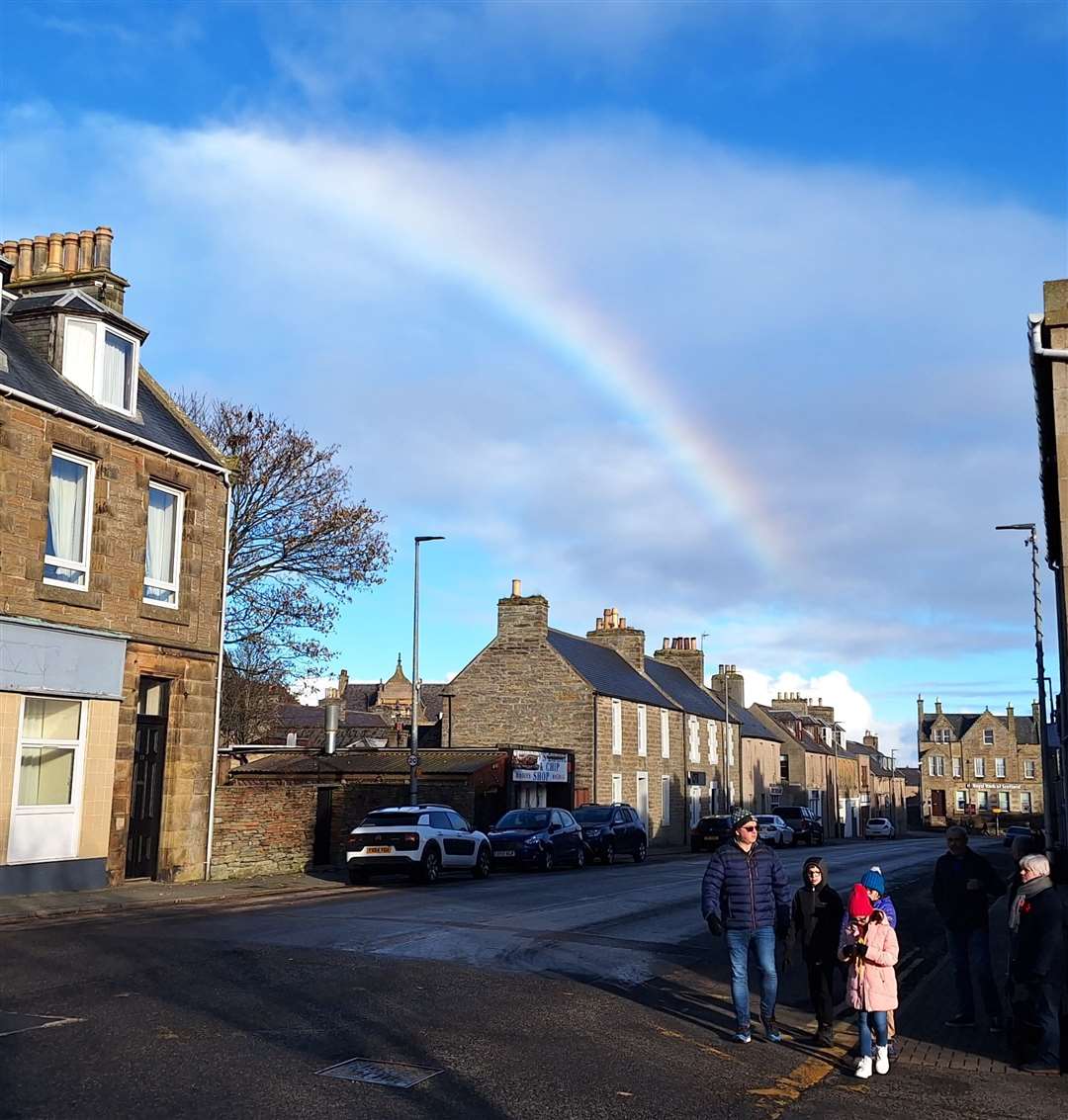 A rainbow appears like a ray of hope at the end of the parade. Picture: DGS