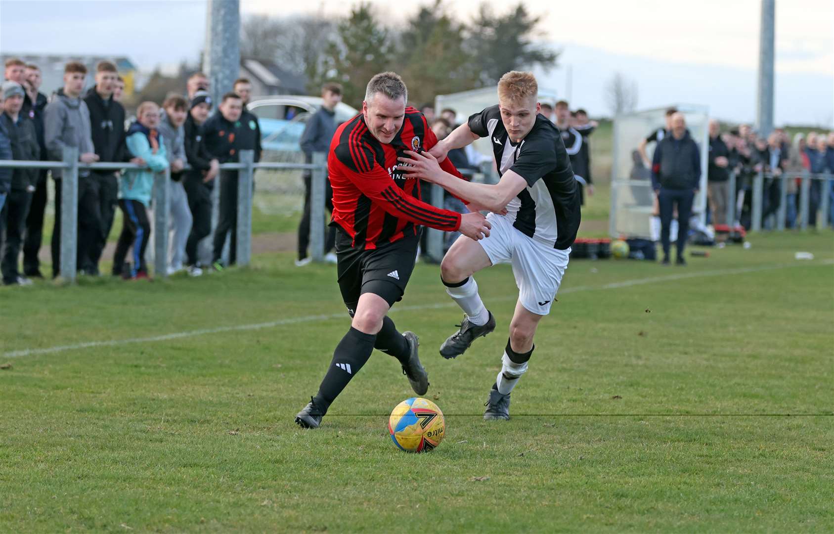 Halkirk's Michael Bremner tussles with Kian Mackay of Thurso Swifts in a second division match last month. Halkirk are on the road to Lochinver in the Highland Amateur Cup this weekend. Picture: James Gunn