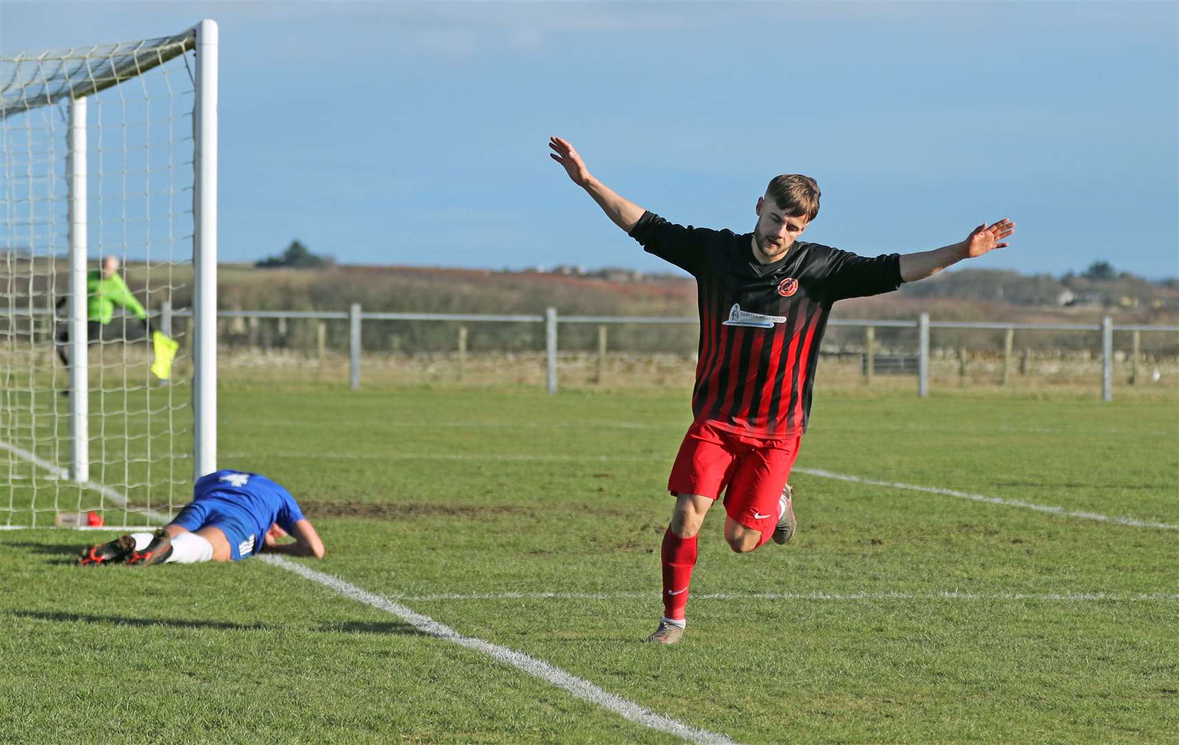 Jonah Martens turns away to celebrate after doubling Halkirk United's lead in the North Caledonian Cup first-round victory over Invergordon. Picture: James Gunn