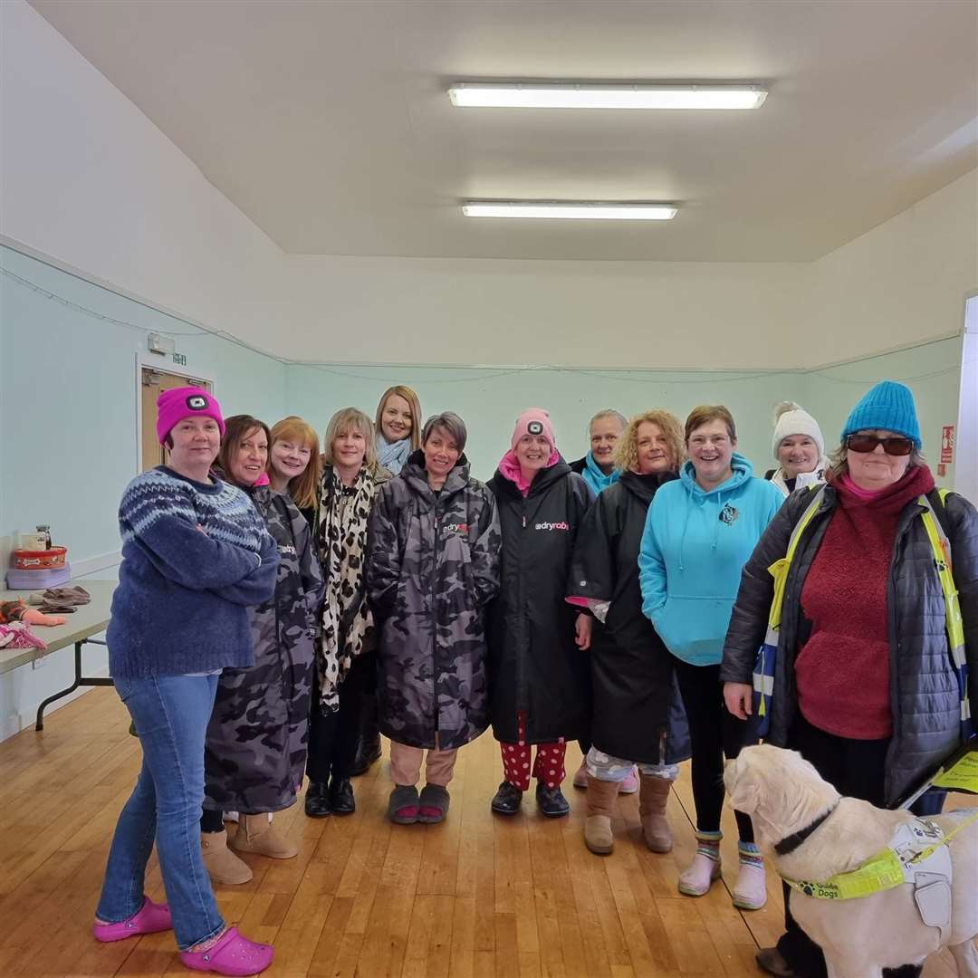 Caron Jones (right) and the rest of the Staxigoe Selkies wild swimming group in the Staxigoe Hall after their International Women's Day dip.