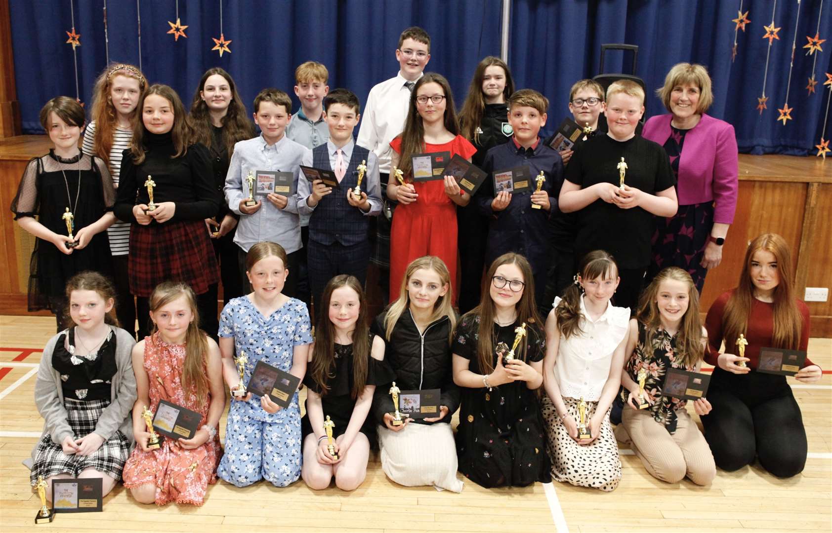 The primary 7 class at Mount Pleasant with their awards and retiring deputy head Christine Firth (back right).