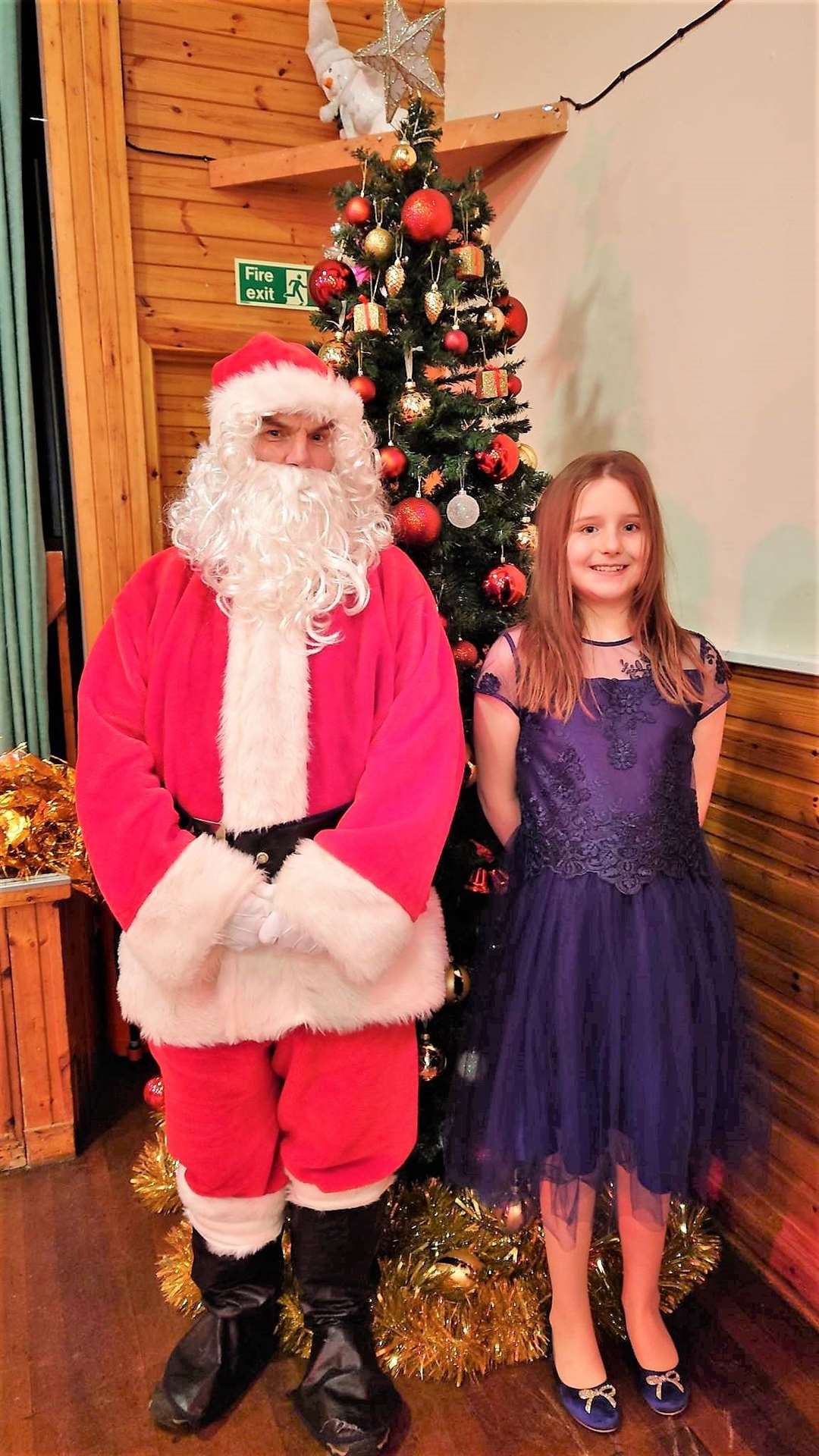 Santa with Emily Henderson at the special Christmas party at Lybster Community Centre.