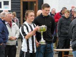 Richard Macadie receives his trophy from Shane Sutherland