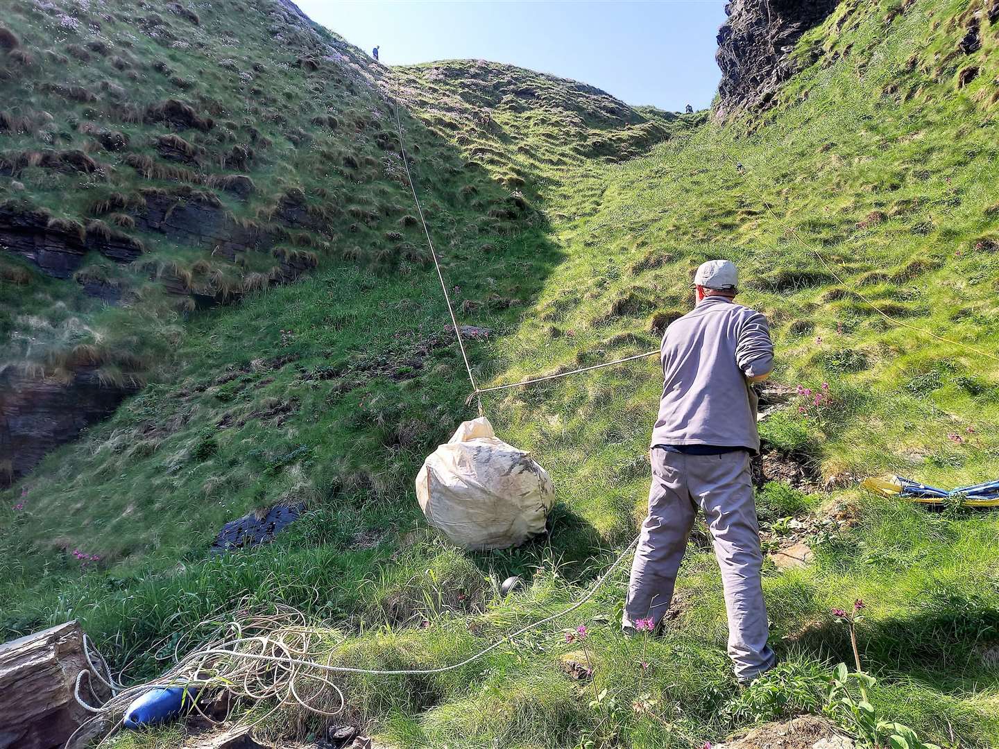 Hoisting rubbish up a steep incline at the inlet near Wick. Pictures: David Shand