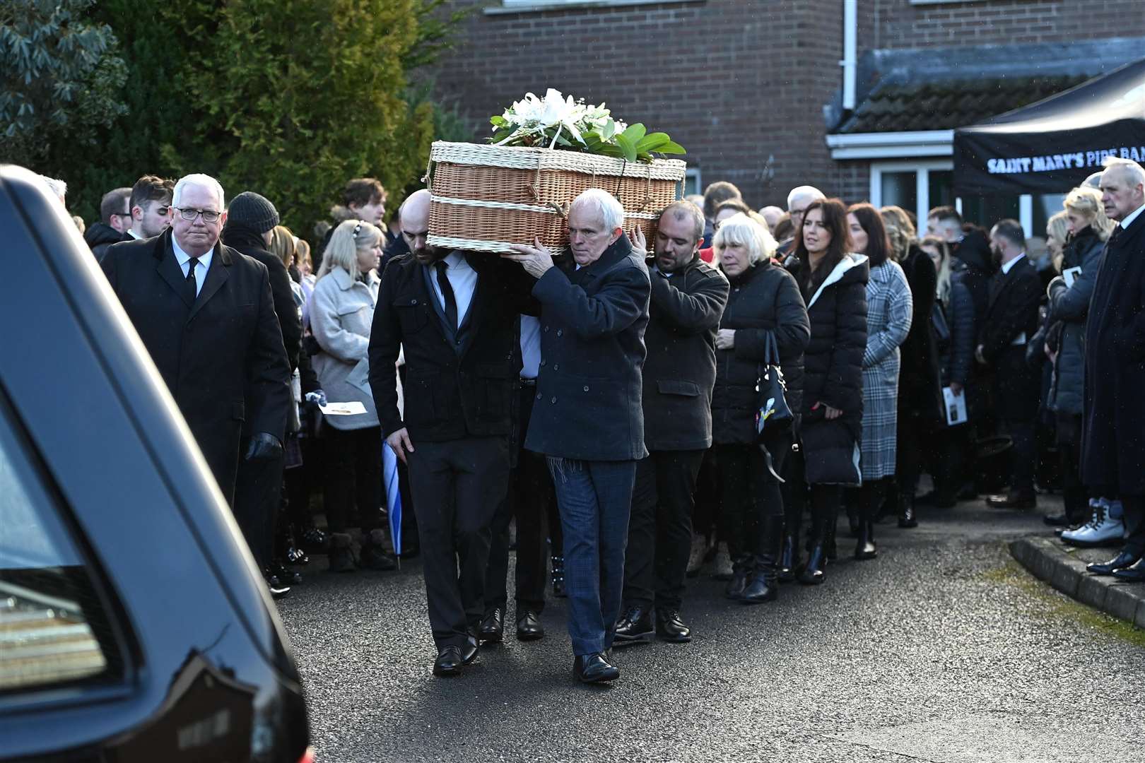 Family members carry the casket of murder victim Natalie McNally following her funeral service at her parents’ home in Lurgan (Oliver McVeigh/PA)