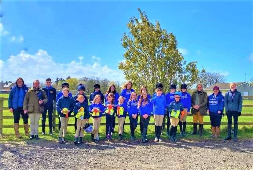 Some of the riders who took part in the recent camp held by Caithness Branch of the Pony Club with their new hi-vis vests, along with coaches and committee members.