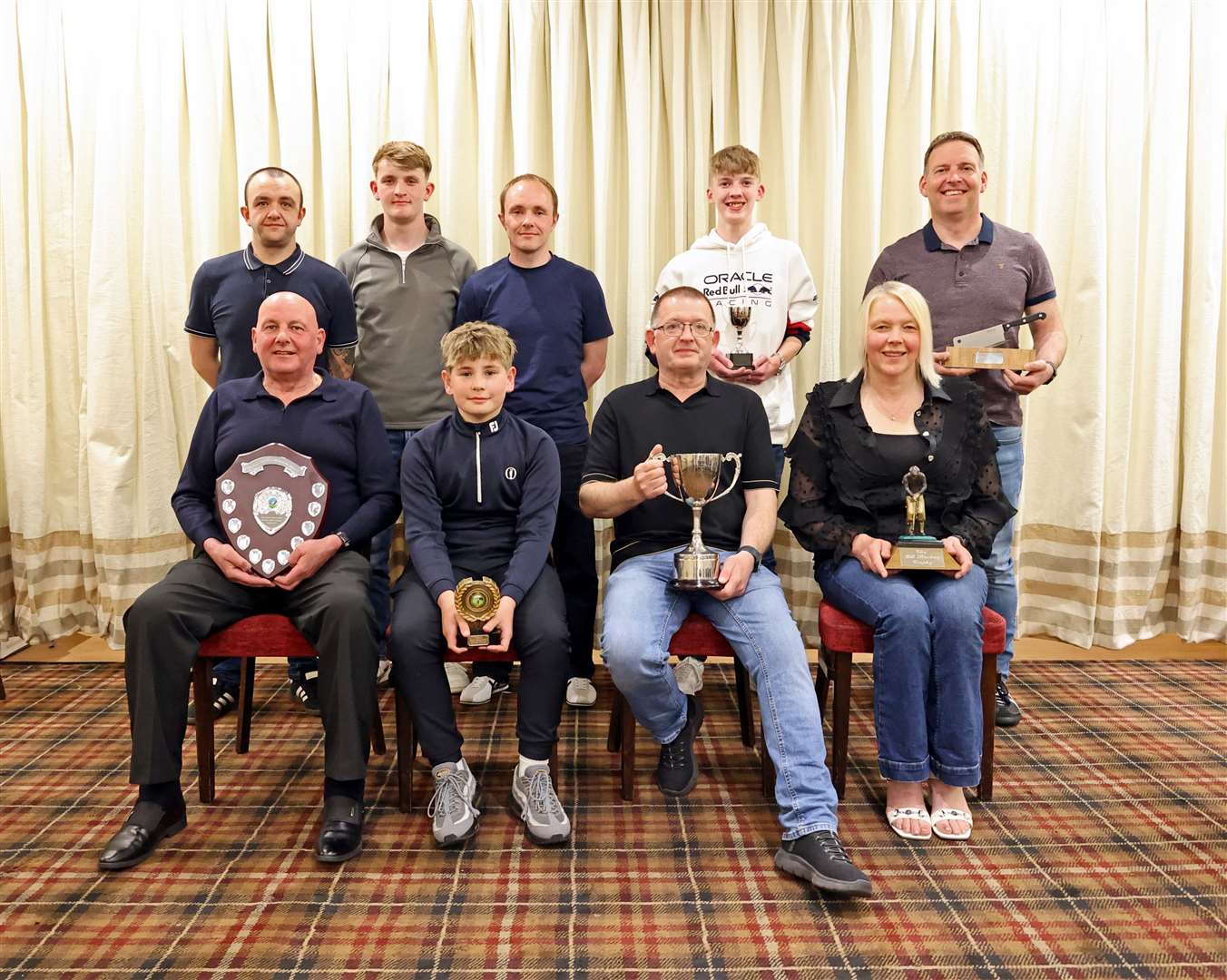 Prize-winners with the memorial trophies after the annual Mackays’ Golf Challenge. Back (from left): David Macadie, Mark Macadie, Richard Macadie, Jamie Main, Aly Mackay. Front: Murray Mackay, Callum McInnes. Sanders Harper, Catherine Harris. Picture: James Gunn