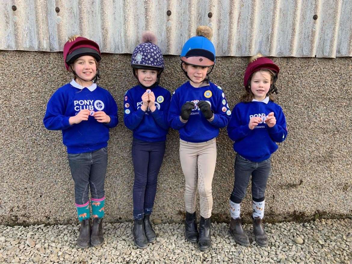 Proudly displaying their new badges are (from left to right) Ella Simpson, Rachel MacGregor, Erica Pottinger and Tessa Simpson.