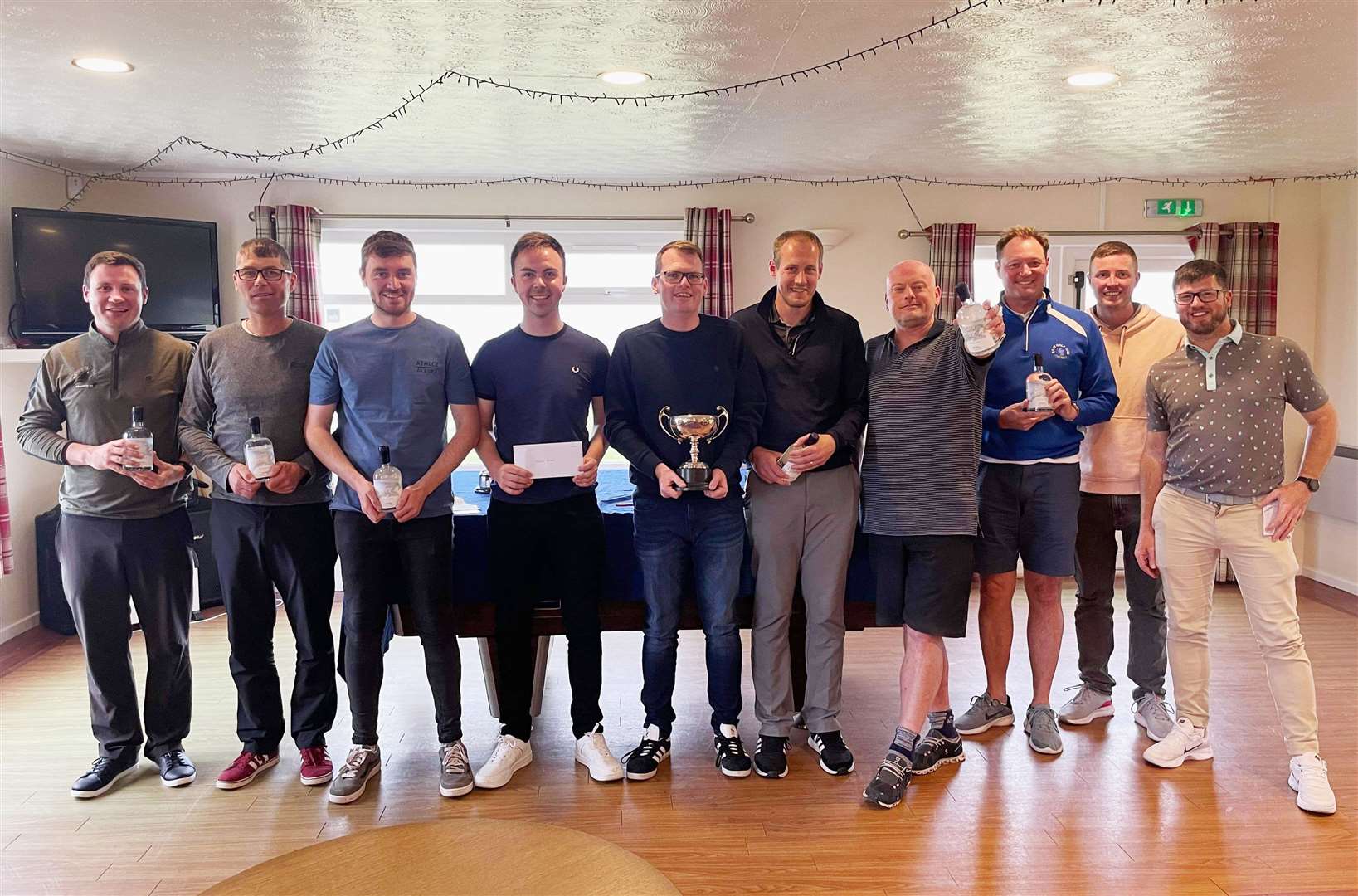 Brent Munro and some of the other prize-winners in the Reay gents' open, sponsored by M2 Procurement and Commercial Services.