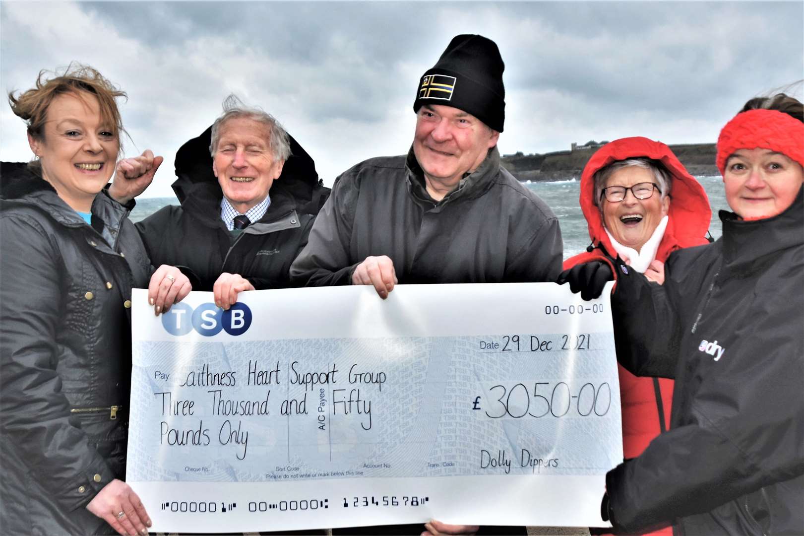 Dolly Dippers Jacqueline Mackay (far left) and Elaine Rosie (far right) hand over a cheque for £3050 at Wick's North Baths to Caithness Heart Support Group members Robin More (second left), Bob Bell (centre), and Joyce Macdonald.