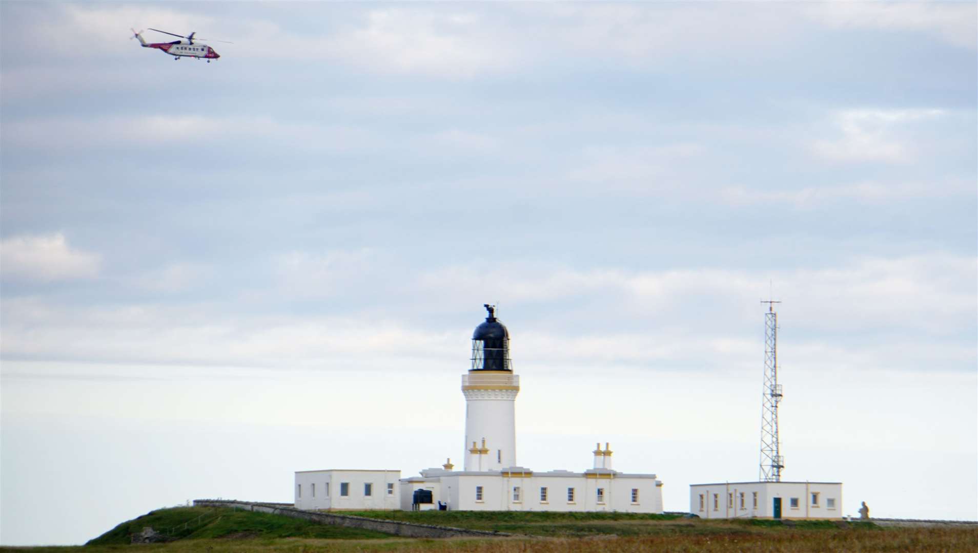 The chopper passes over Noss Head lighthouse and heads to the infirmary in Aberdeen.
