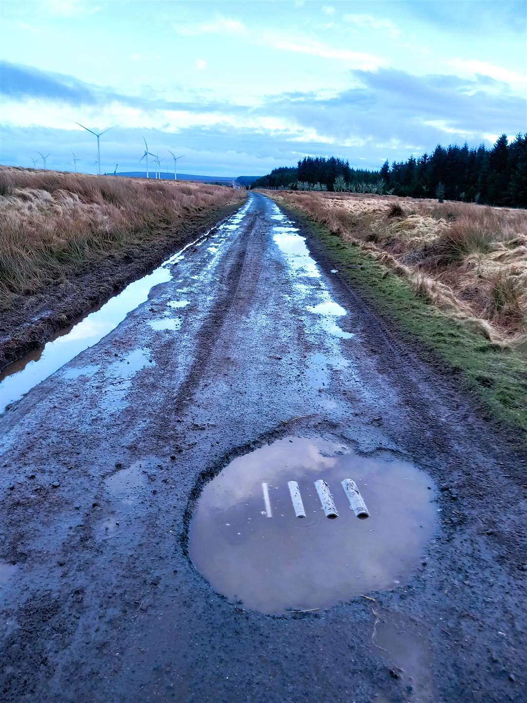 The southern part is, however, riddled with deep potholes. The three tubes in the large pothole are part of a cargo of asbestos sheeting which Peter thinks bounced out of a trailer. Both pictures were taken on March 2, 2024. Pictures: Peter Darmady