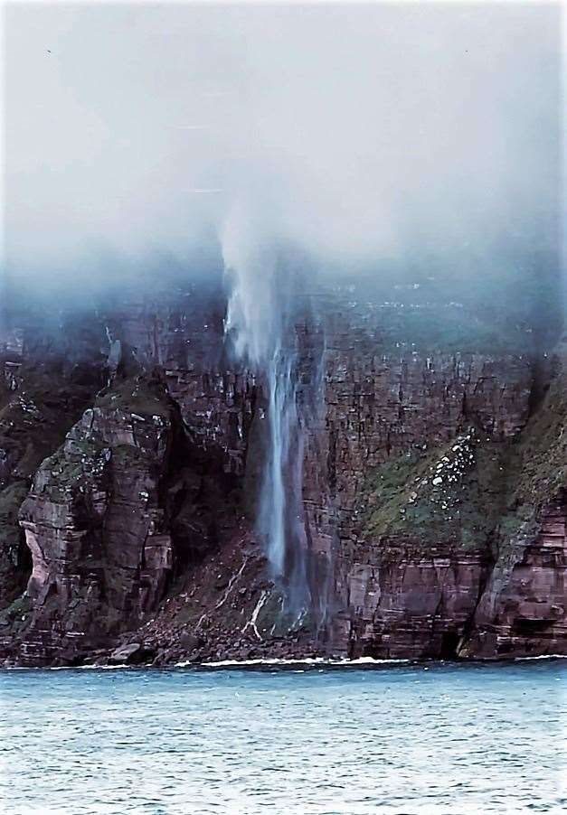 Stourdale Waterfall on Hoy. Heavy mist was lifting the top of the waterfall and dropping it forward of its natural fall zone. Picture: Robert Aitken.