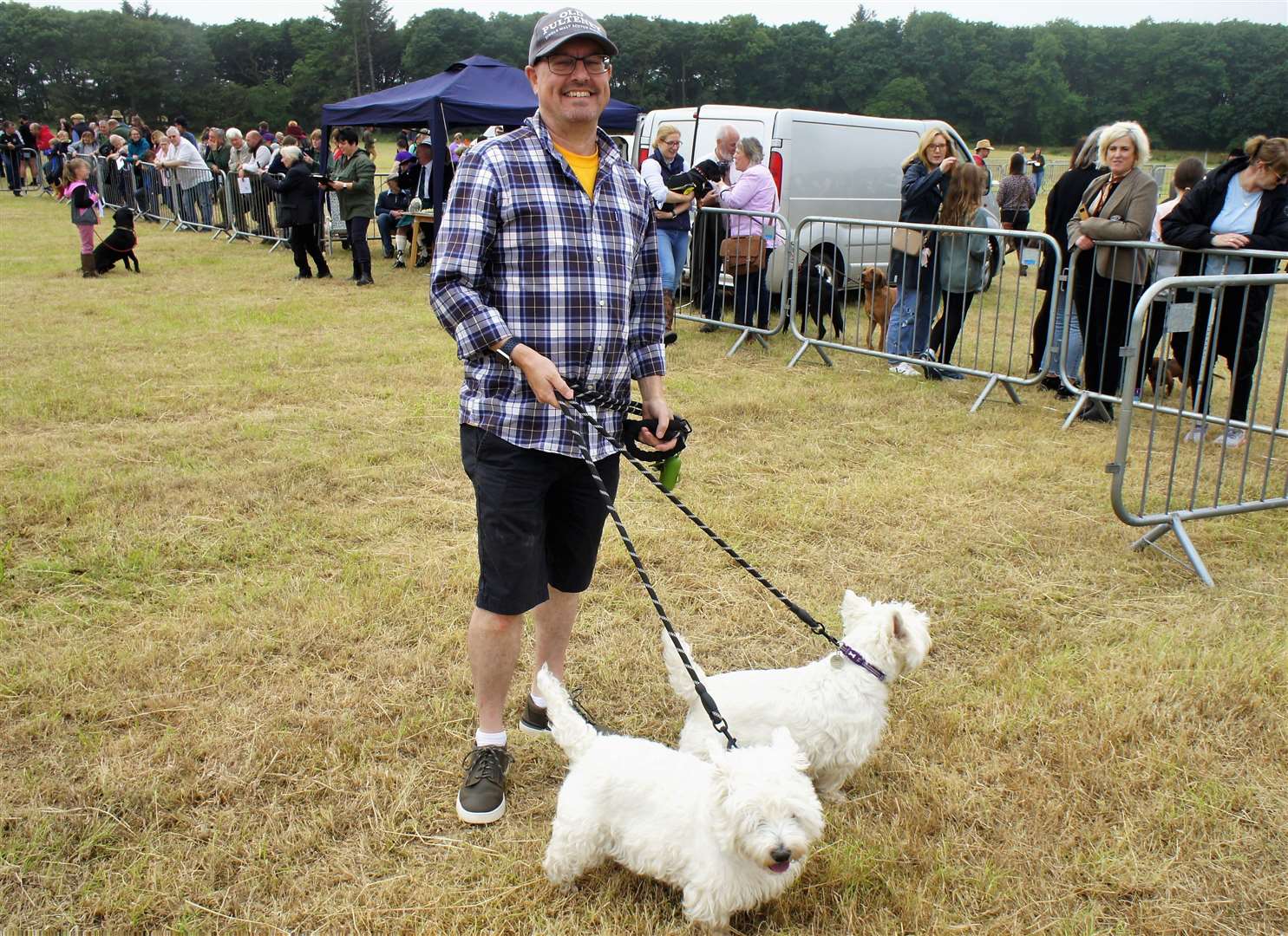 Dounreay managing director Mark Rouse visited the event with his pet dogs. 'Every weekend there's something to do here in Caithness,' he said. Picture: DGS
