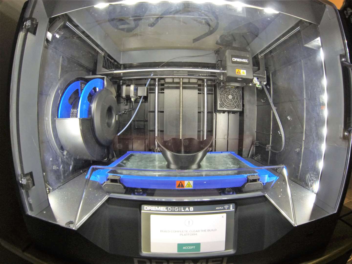 A PPE mask in the process of being made inside the 3D printer. Pictures: Chris Aitken