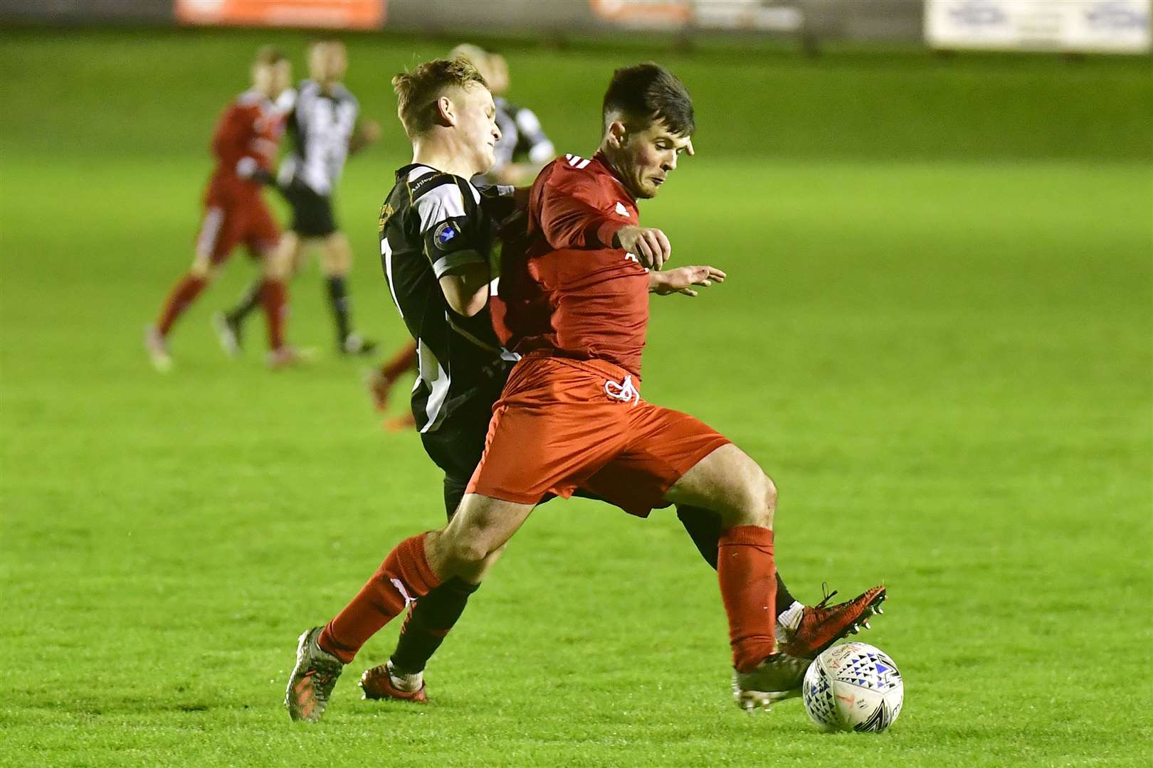 Thurso's Sean Campbell in action against Mark Macadie of Wick Academy in this week's Harmsworth Park friendly. Academy ran out 6-0 winners. Picture: Mel Roger