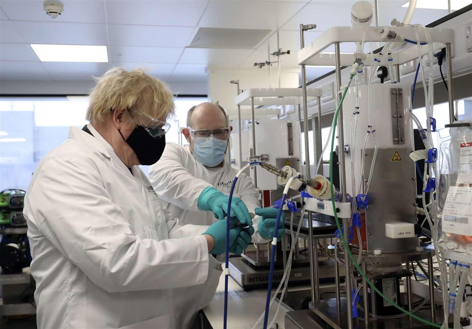 Boris Johnson visits the Fujifilm Diosynth Biotechnologies vaccine plant in Teesside (Scott Heppell/PA)