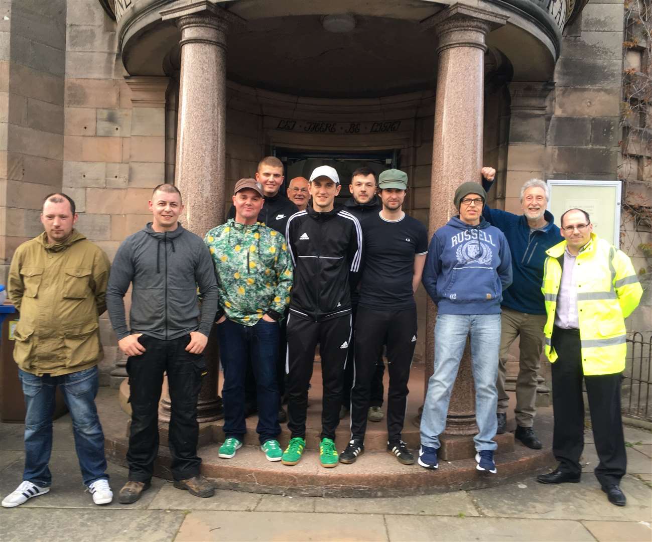 Caithness Foodbank volunteers outside Wick's former Carnegie library with chairman Grant Ramsay fifth from left.