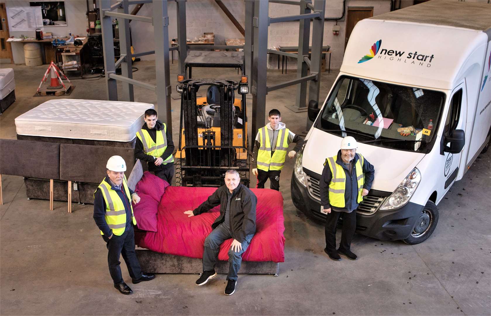 At front from left are Brendan Brankin, JFN Bower facility manager, Ally Waugh from New Start Highland sits on one of the donated beds and next to him is Kenneth Green EHSSQ engineer with JFN. At the rear are Lewis Scott and Dylan Campbell from New Start. Picture: John Baikie
