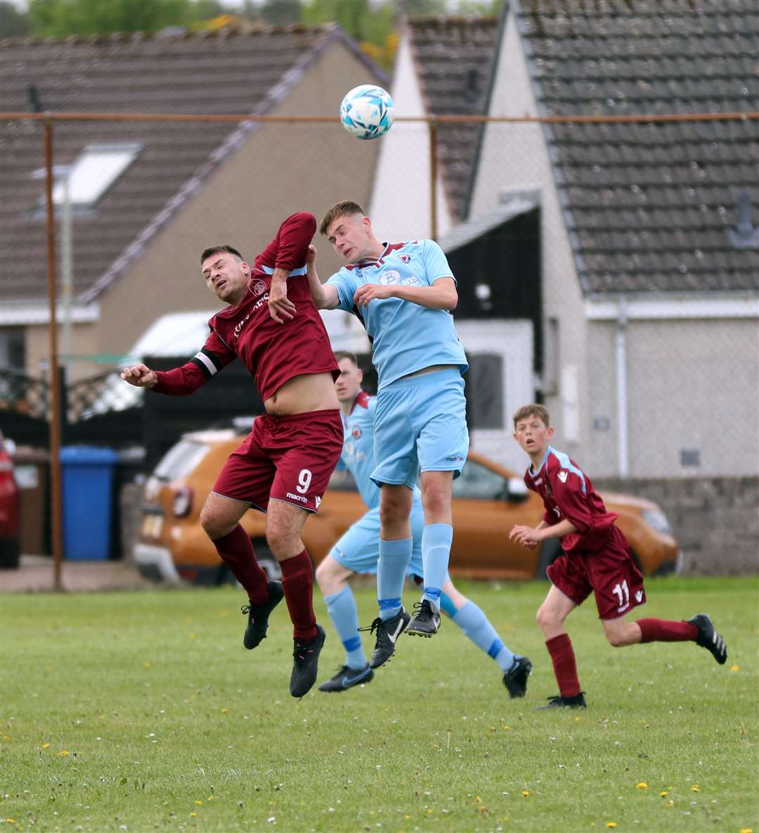 Mark Hutcheon of Top Joe's in an aerial duel with Pentland United's Conor Trueman in the first round of the Highland Amateur Cup. Picture: James Gunn