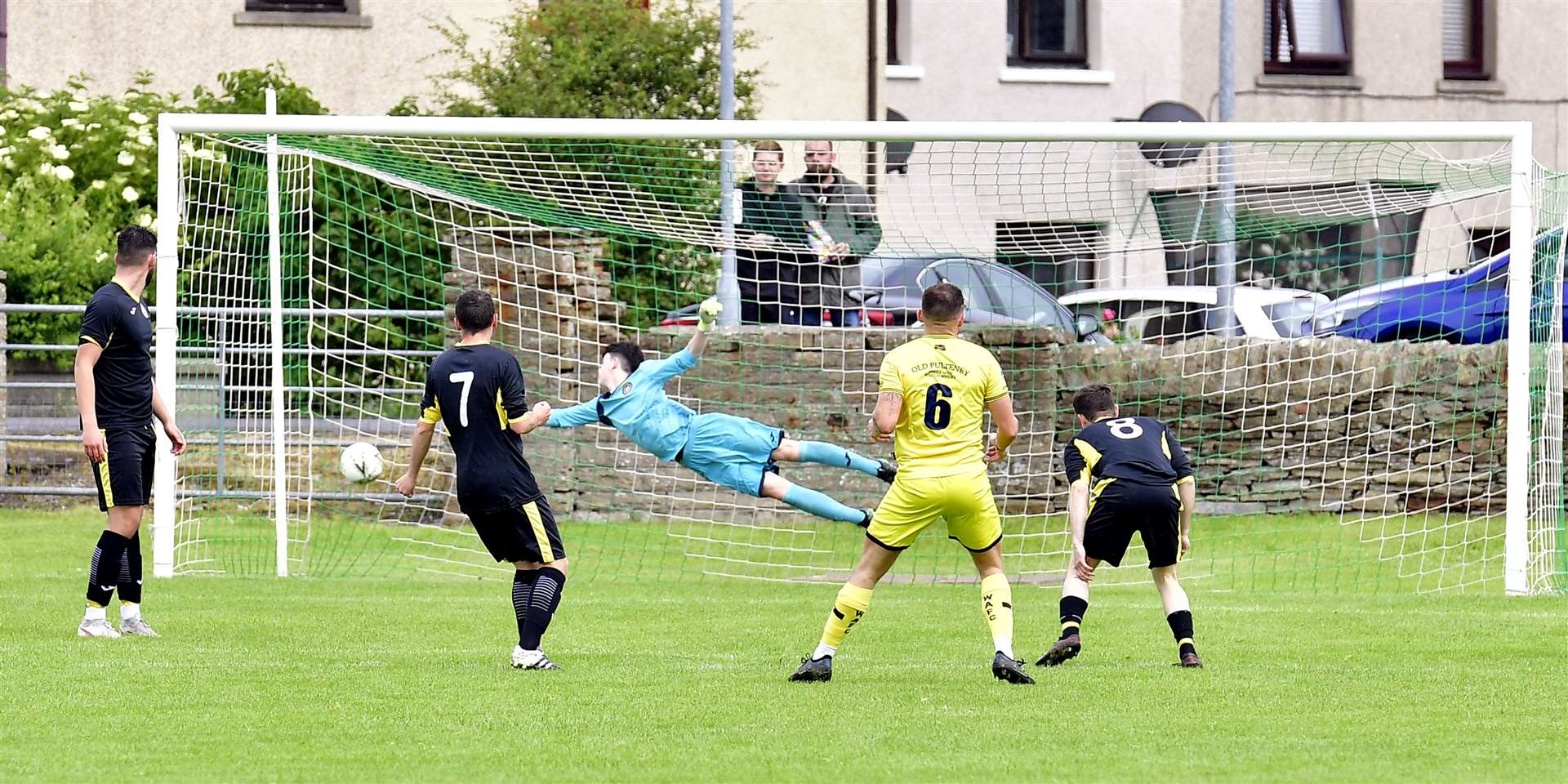 Jack Henry watches as his shot beats Caithness AFA keeper Leo Shearer. Picture: Mel Roger
