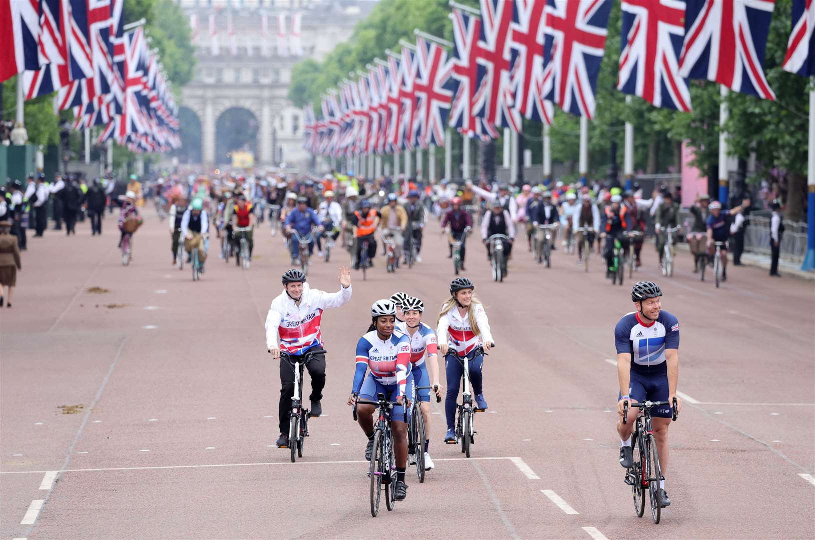 Sir Chris Hoy and members of the Team GB cycling team ride down the Mall (Chris Jackson/PA)