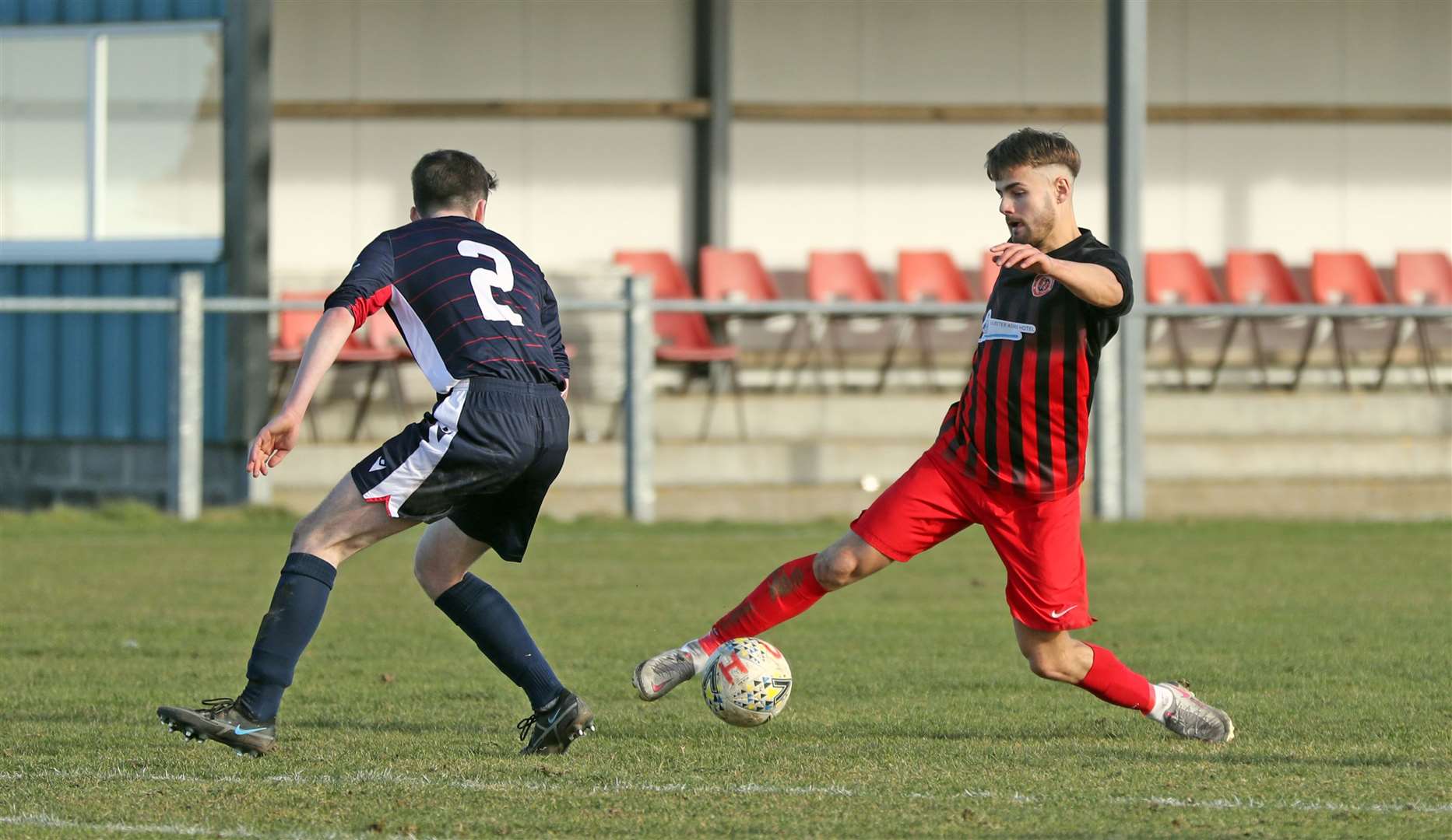 Halkirk United striker Jonah Martens tries to get past Cal White of Inverness Athletic. Picture: James Gunn