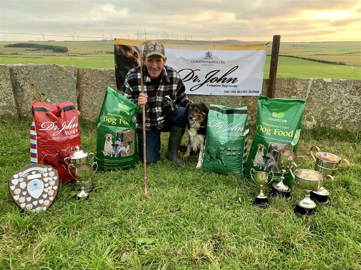 Michael Shearer and Tib with some of the trophies and prizes from the local trials.